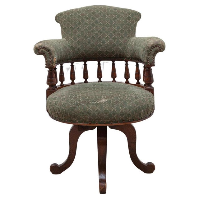 Beautiful traditional shipping era swivel Chippendale desk chair. The Captain's Chair, with the modern addition of a turn...