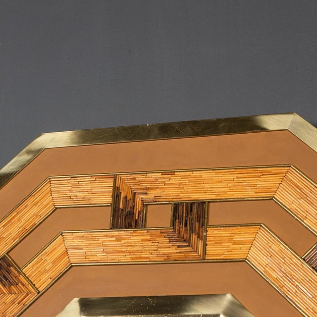 Crafted in the mid-20th century, this octagonal mirror showcases a striking geometric design fashioned from reeds and...