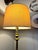 Beautiful vintage brass floor lamp featuring an integrated round glass side table. Features a substantial decorative...