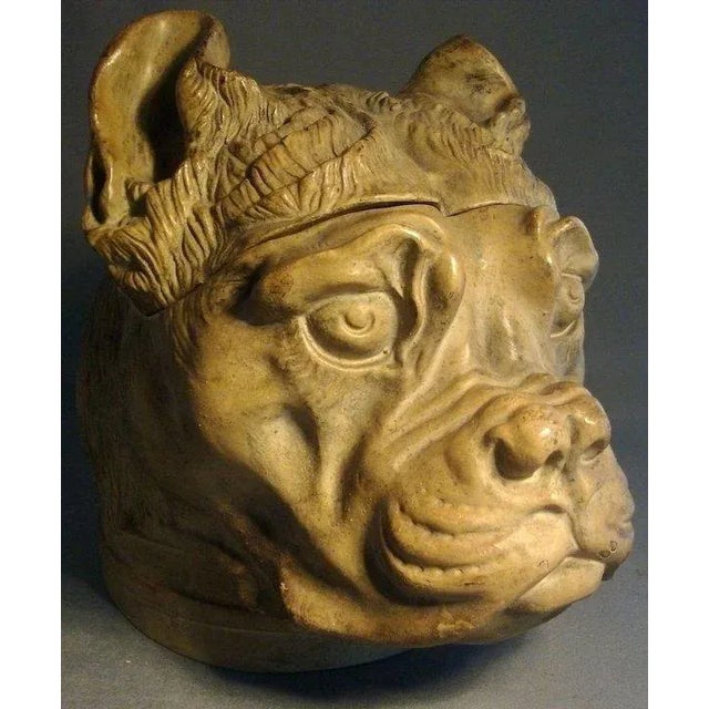 A wonderful and finely detailed 19th c. jar or box in the form of a dog's head. Probably used as a humidor for tobacco....
