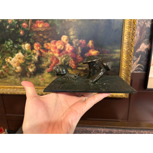 A wonderfully unusual and whimsical vintage patinated metal sculpture depicting two anthropomorphic mushrooms leaning...