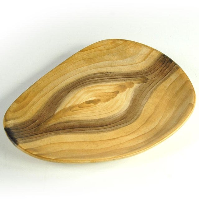 A striking ceramic plate from the French factory Grandjean-Jourdan, located in Vallauris. Its design is striking,...