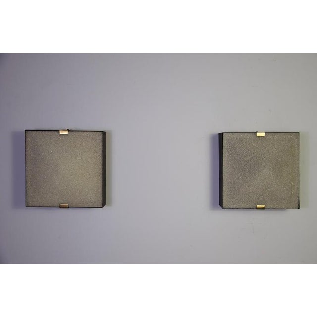 A refined pair of square mid-century flush mounts, produced in italy during the 1960s. The lamps feature a clean geometric...