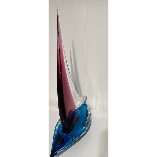Beautiful glass sailboat sculpture captures the freedom and movement of a summer's day on the water. Handblown Formia...