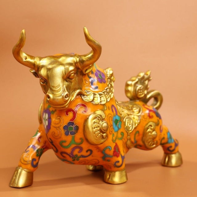 This charming sculpture depicts a standing ox or bull, a traditional symbol of strength, diligence, and wealth. The figure...