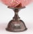 Late 19th-century Moser Bohemian art glass compote in richly colored cranberry glass, hand decorated with polychrome...