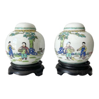Pair of Vintage Chinese Porcelain Ginger Jars With Children Feeding Ducks on Ebony Stands For Sale