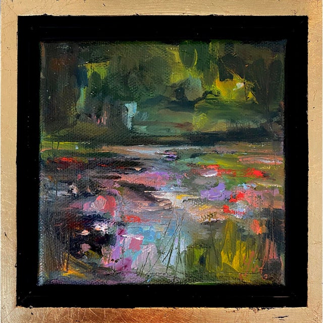 This oil on canvas artwork captures a serene garden scene with a vibrant interplay of colors, reminiscent of blooming...