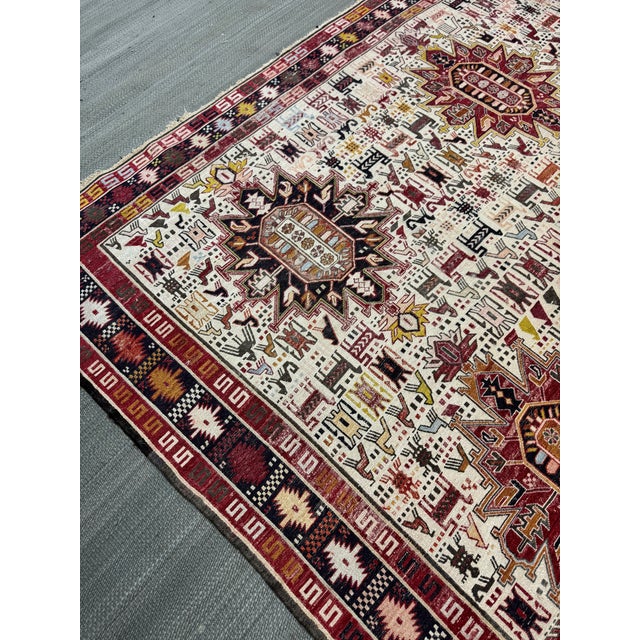 Design Plus Gallery presents a 6ft 9in × 9ft 9in Flat Woven Afghan Area Rug. This is a traditional tribal wool area rug...