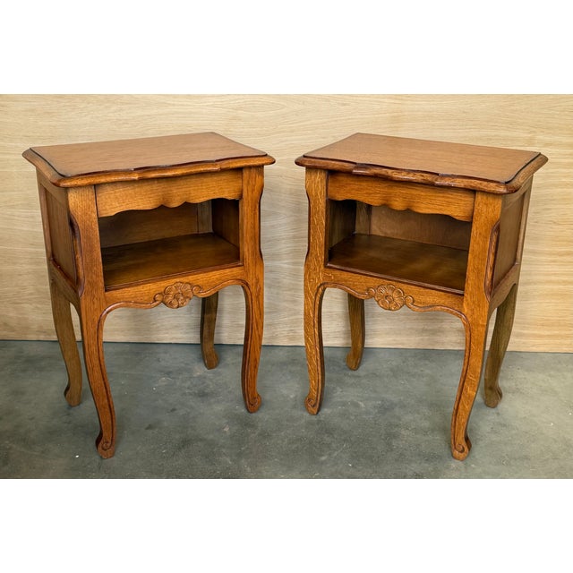 A pretty pair of French walnut nightstands and one drawer with open shelf, circa 1940. Pair of French Louis XV style...