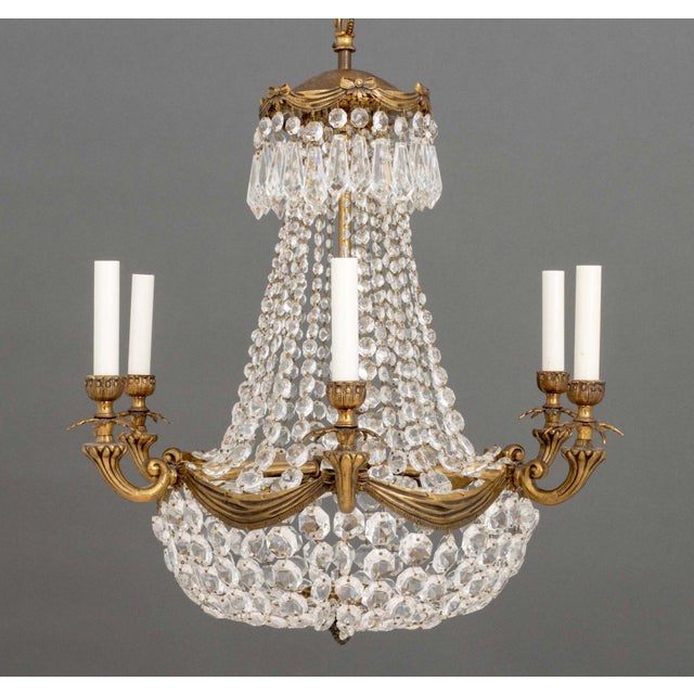 French Empire Style Bronze Basket Chandelier, the six branches with ribbon and garland frame, top tier of faceted drop...