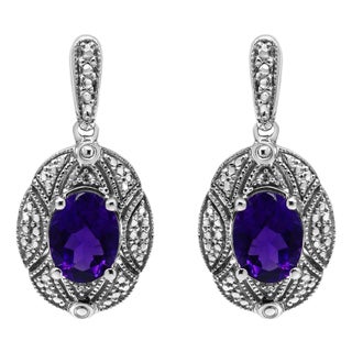 .925 Sterling Silver Diamond Accent and 8x6mm Purple Oval Amethyst Stud Earrings (I-J Color, I1-I2 Clarity) For Sale