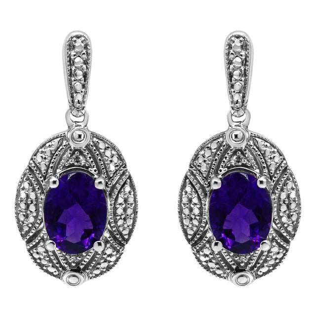 .925 Sterling Silver Diamond Accent and 8x6mm Purple Oval Amethyst Stud Earrings (I-J Color, I1-I2 Clarity) For Sale