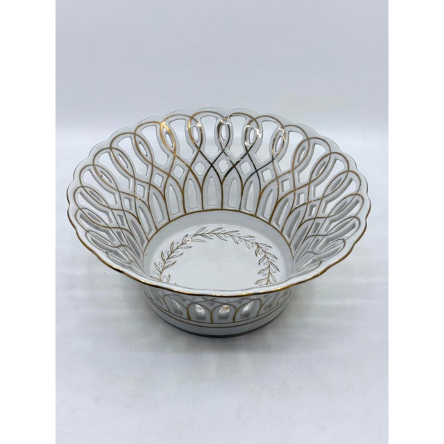 Antique Paris reticukated porcelain decorative bowl. Gold leaf design throughout. A beautiful piece to add to your...