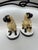 Charming pug dogs on pedestal bases with grumpy expressions in fine ceramic by esteemed design firm Chelsea House -...