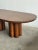 W96.5 D44.5 H30 KC27 This minimalist silhouette features a large racetrack repurposed vintage oak tabletop with sculptural...
