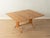 Unique dining/coffee table from the 1950s by Wilhelm Renz. Height-adjustable solid walnut frame with a fold-out walnut...