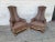 Vintage set of two mid-century Hollywood regency style wood legs with faux leather high back chairs. Carved wood legs....