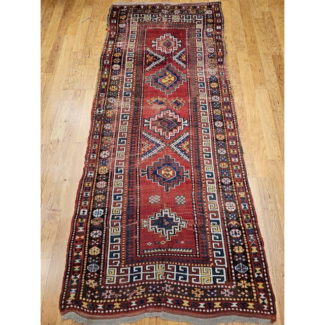 Discover the powerful artistry and timeless beauty of this magnificent Late 19th Century Antique Caucasian Kazak Area Rug...