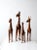 This set of four vintage giraffe sculptures is hand-crafted in leather and finished with carefully painted detailing. Each...