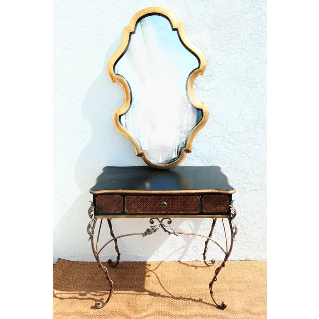 A sweet small black and brown, rust decorative desk or vanity. This piece can be utilized as a vanity or a small bedroom...