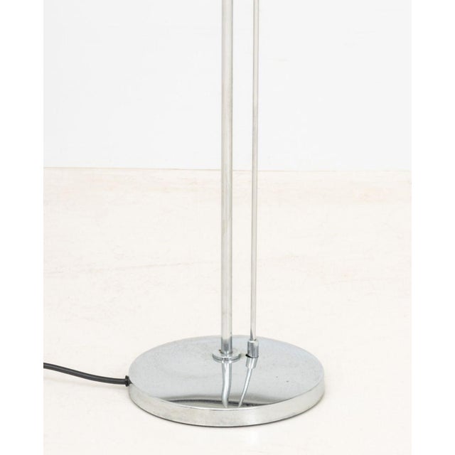 Estiluz Chrome-Plated Floor Lamp, with circular shade and base, marked to underside. 72.5" H x 8.5" D. Provenance: From...