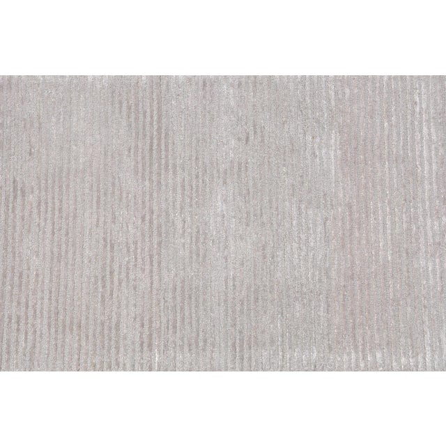 Add a touch of modern elegance to your home with Pasargad Home's Edgy Hand-Tufted bamboo Silk & Wool Area Rug. Made of...