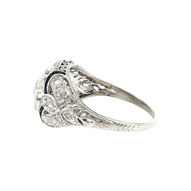 A platinum Art Deco ring. Features an approximately 0.70 carat Old European cut diamond, white in color, with SI1 clarity...