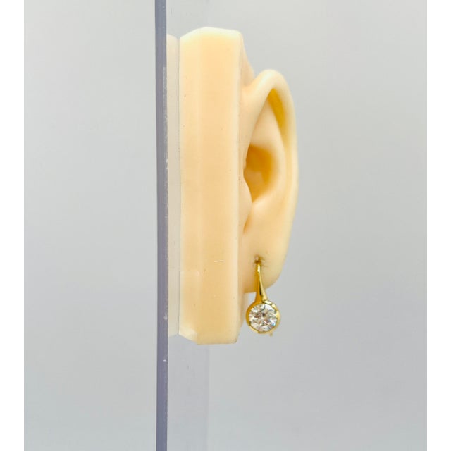 Gorgeous 4.45 ct. L-M VS2-SI2 diamond rounds. Handmade in 18k yellow gold. Both stones come with a GIA certificate.