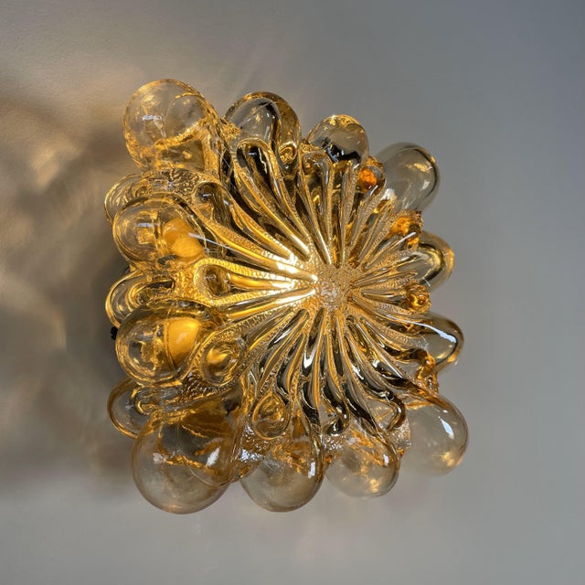 Subtle ceiling lamp by Glashutte Limburg, designed by Finnish designer Helena Tynell in the 1970s. The lamp gives a...