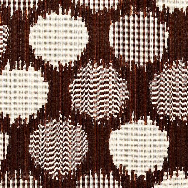 A medley of yarns and a complicated weave structure create the striated effect of this sophisticated dot pattern. Textured...