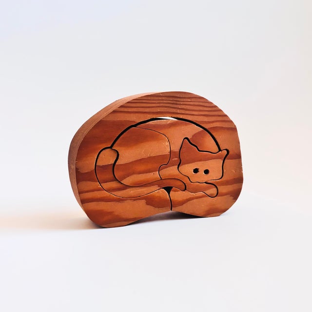 A vintage wood toy cat puzzle. Measures 7.25"W x 1.5"D x 5.25"H