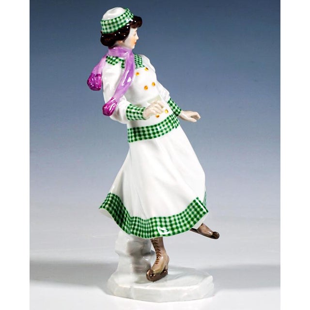 Delicate meissen art nouveau porcelain figure: skater in elegant winter attire: costume consisting of a long skirt and...
