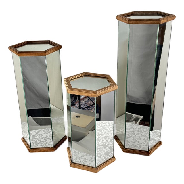 1970s Trio of Hollywood Regency-Style Hexagonal Mirrored Art Pedestals With Oak Wood Trim. For Sale