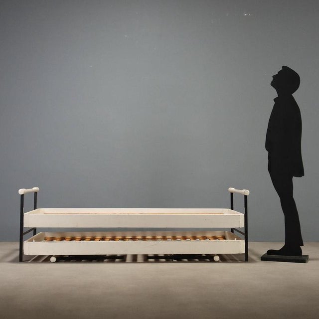 Pair of 'L75' model beds designed by Osvaldo Borsani for Tecno production, featuring a functional and elegant design. Made...
