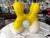 A massive stoneware abstract sculpture with a yellow partial glaze. Vaguely resembles a molar tooth or a couple embracing....
