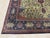 An 8' 10" x 11' 1" hand-knotted wool rug with an ivory field of dense floral vines around a central medallion, framed by a...