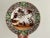 This vintage Chinese porcelain plate features a lively and detailed scene of monkeys climbing on wisteria branches, set...