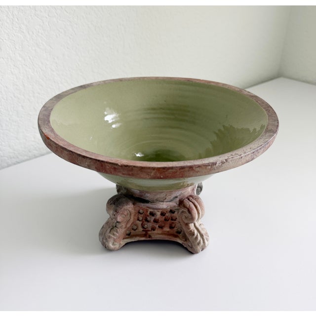 A wonderful celadon-glazed terracotta vessel with Italianate detailing. It features a wide, flared shallow basin supported...