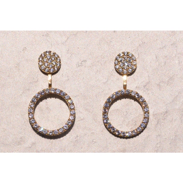 The 200th Street: Convertible Earrings in Yellow Gold. The earrings feature a top round pave set disk. Below the top is a...
