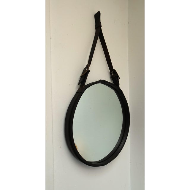 Large Sadderly Leather Round Mirror by Jacques Adnet, 1940s, in Good conditions. Designed 1920 to 1949