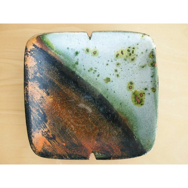 -Highly collectible design object. Beautiful two-tone glaze finish. -Measures approximately 8 square. -Excellent vintage...