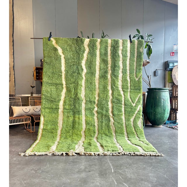 This refined Moroccan Beni Ouarain rug is a contemporary expression of traditional Berber craftsmanship. Handwoven in the...