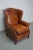 This cognac-colored leather club chair comes from the Netherlands. It is upholstered with cognac-colored leather and...