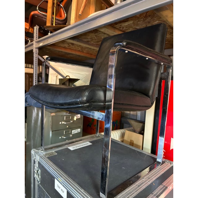Crafted by ChromCraft in the 1960s, this vintage Mid-Century Modern armchair features the company's distinctive cantilever...