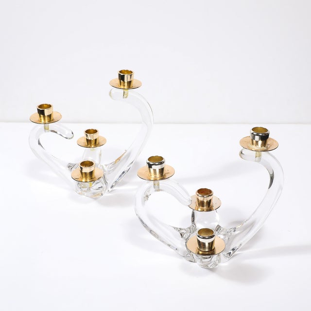 This exquisite pair of mid-century four-arm candelabra, signed Schneider, exudes the timeless grace and refinement...