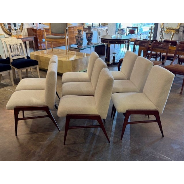 These Mid Century Modern Italian Art Deco Style Chairs are a sleek and elegant addition to any living space. With a white...