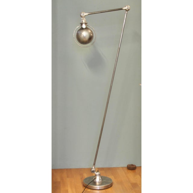 Large two-armed floor lamp from the design classic with a long (approx. 150cm) and a short (approx. 40cm) arm. This...