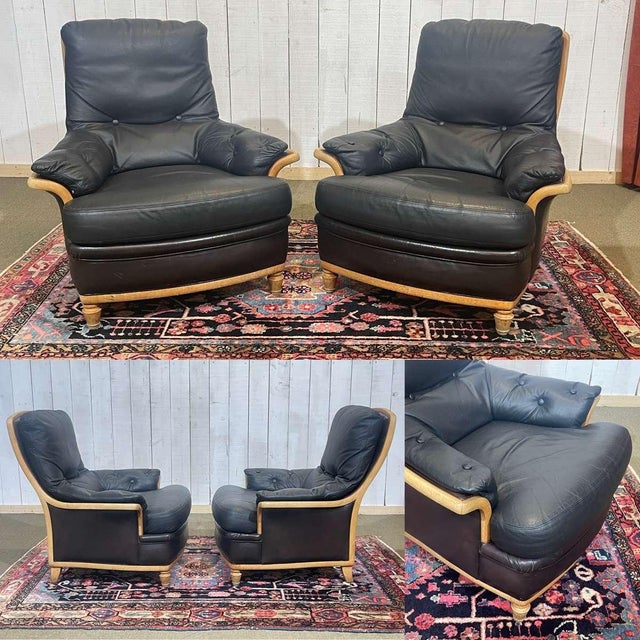 Pair of leather and beech armchairs from the 1970s - W=87cm, H=88cm, seat height=45cm, D=90cm.