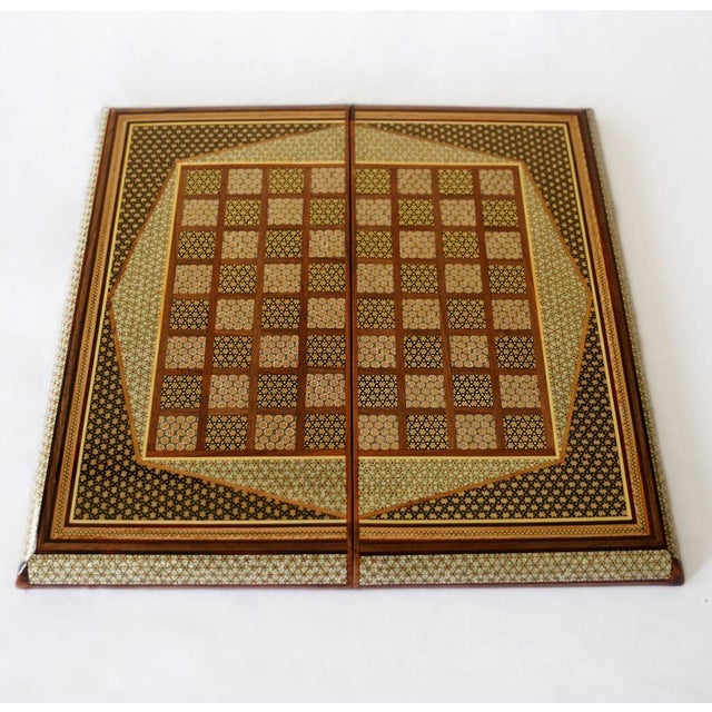 This handcrafted chess and backgammon set features a finely detailed geometric marquetry design created using traditional...